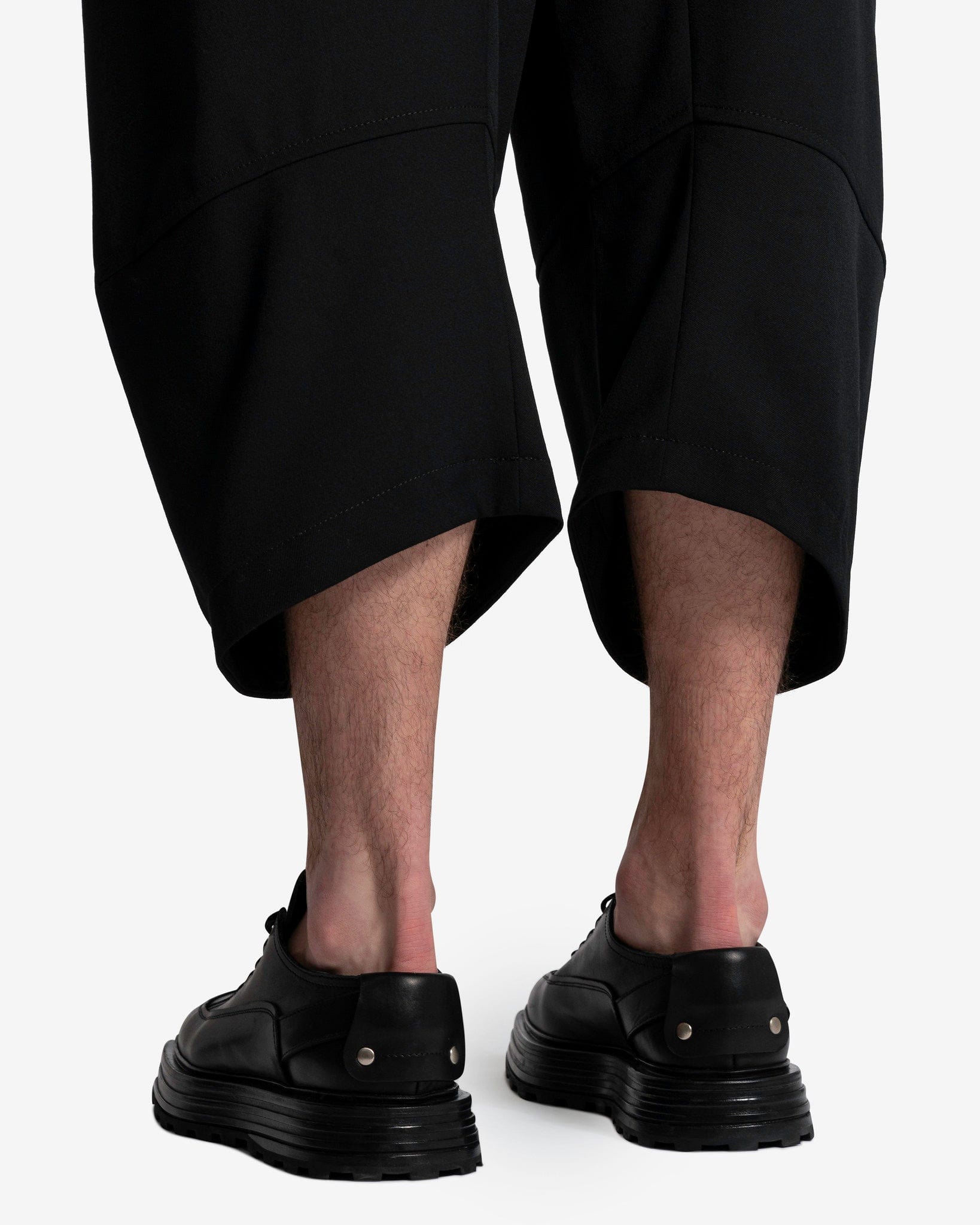 Black Comme Des Garçons cropped wool trousers