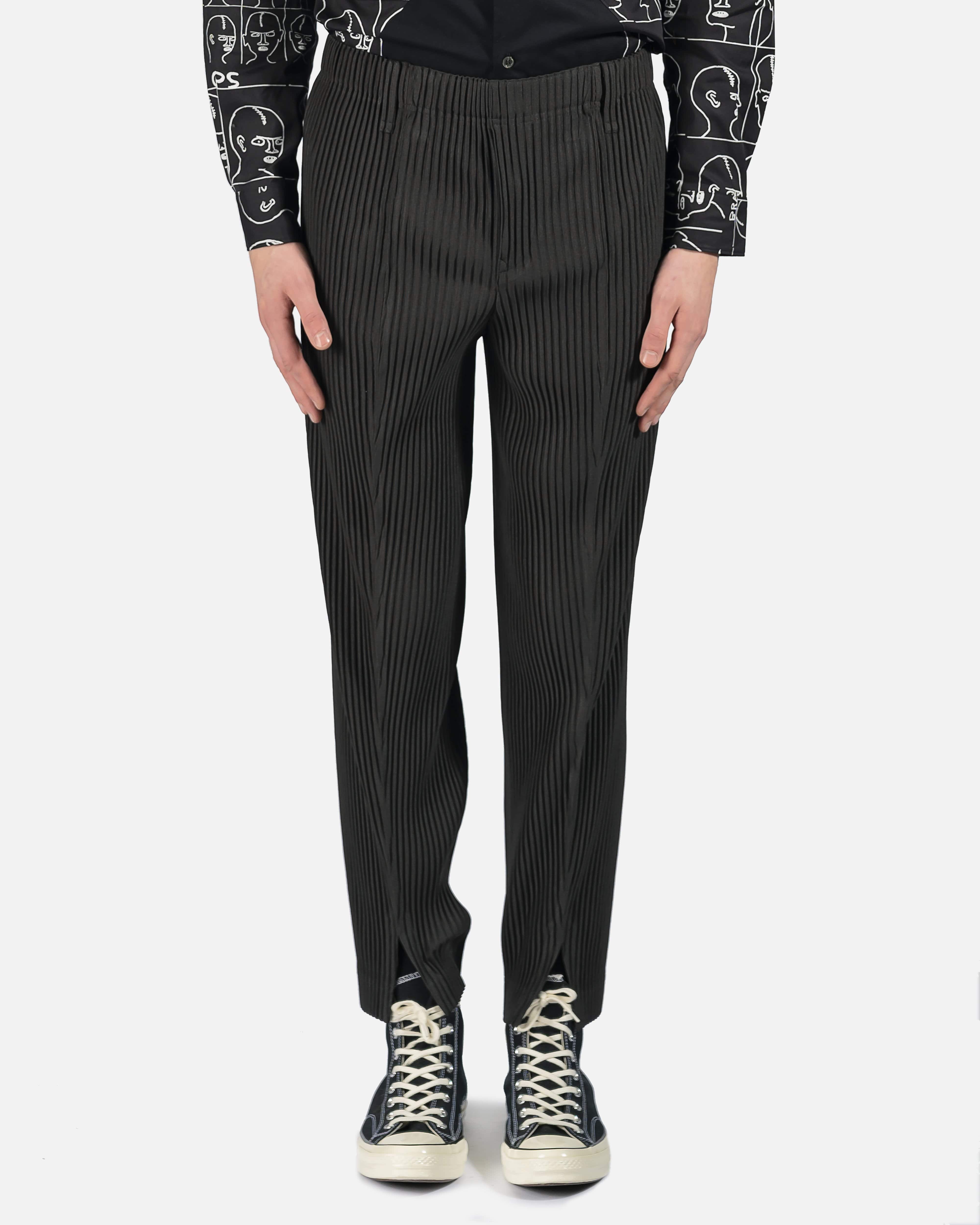 Black Tapered technical-pleated trousers | Homme Plissé Issey Miyake |  MATCHES UK
