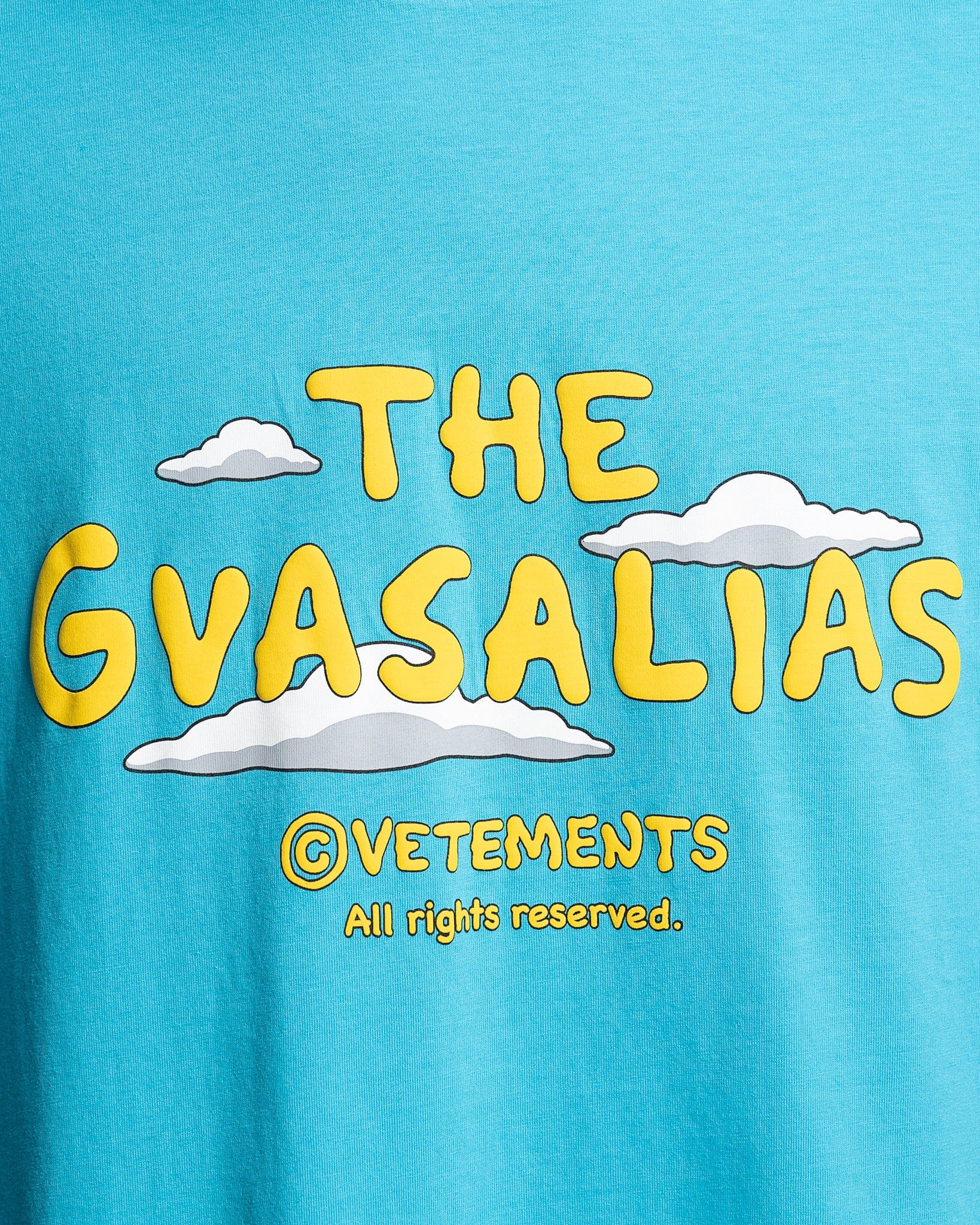 The Gvasalias Cartoon Logo T-Shirt in Sky Blue